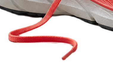 Loose shoe lace and the edge of the sole after background removal, on white, at 100%